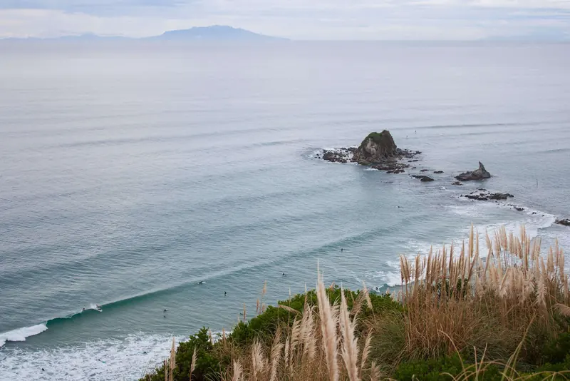 Clean lines of swell wrap into Mangawhai Heads beneath the headland